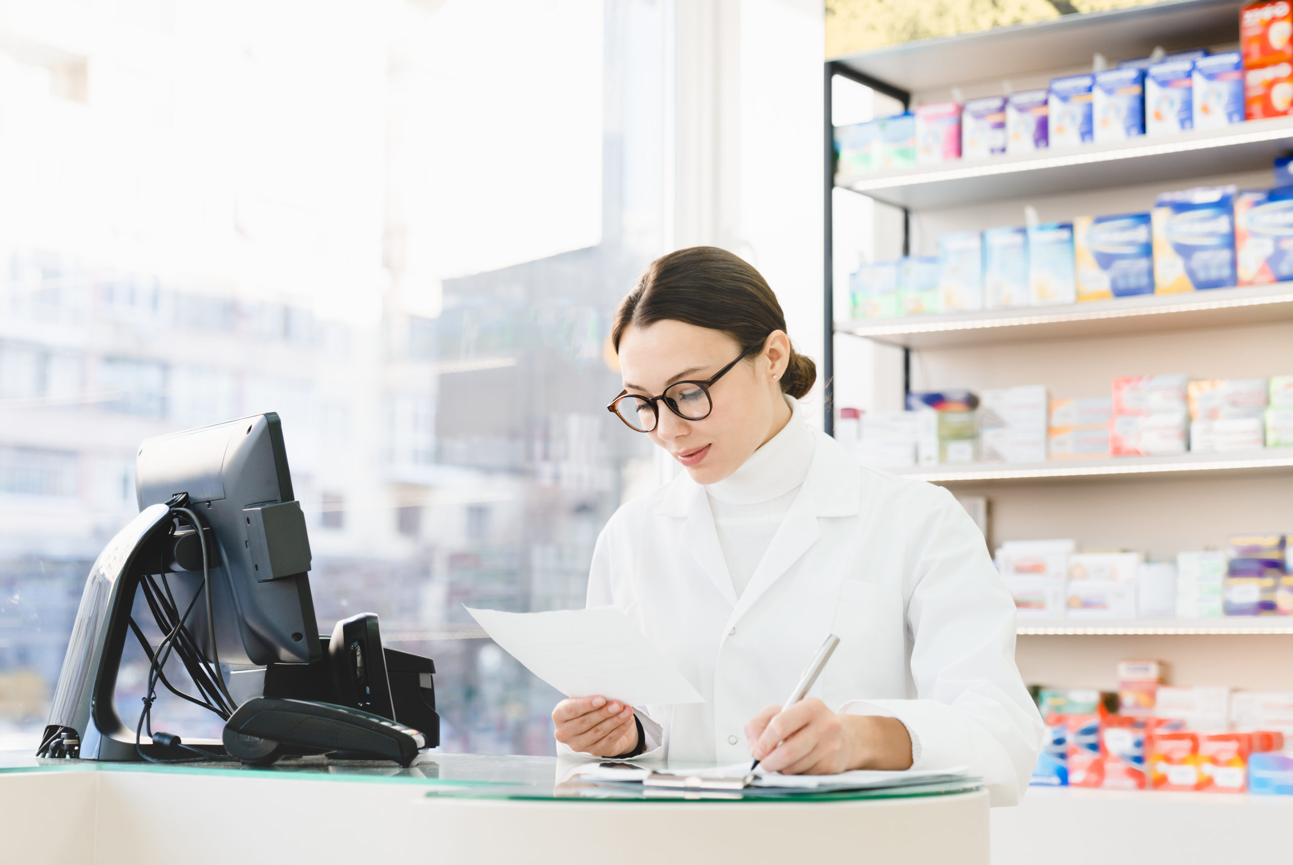 Druggist Checking Writing Information About Medicines Pills Remedies On Prescription In Pharmacy - KAPCON CONTABILIDADE